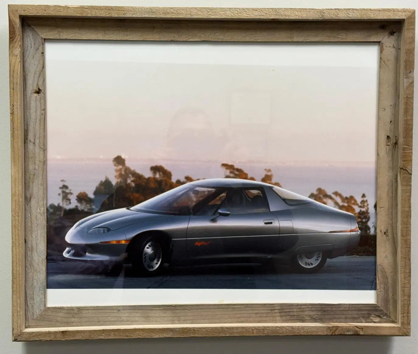 1 of 2 Real Photo taken of the 1990 General Motors Impact concept car, which later went into production as the GM EV1, the first modern mass-produced electric vehicle from a major American automaker. Heritage Pastime