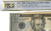 Close-up of 2006 $20 bill engraving details and rare reverse ladder serial number