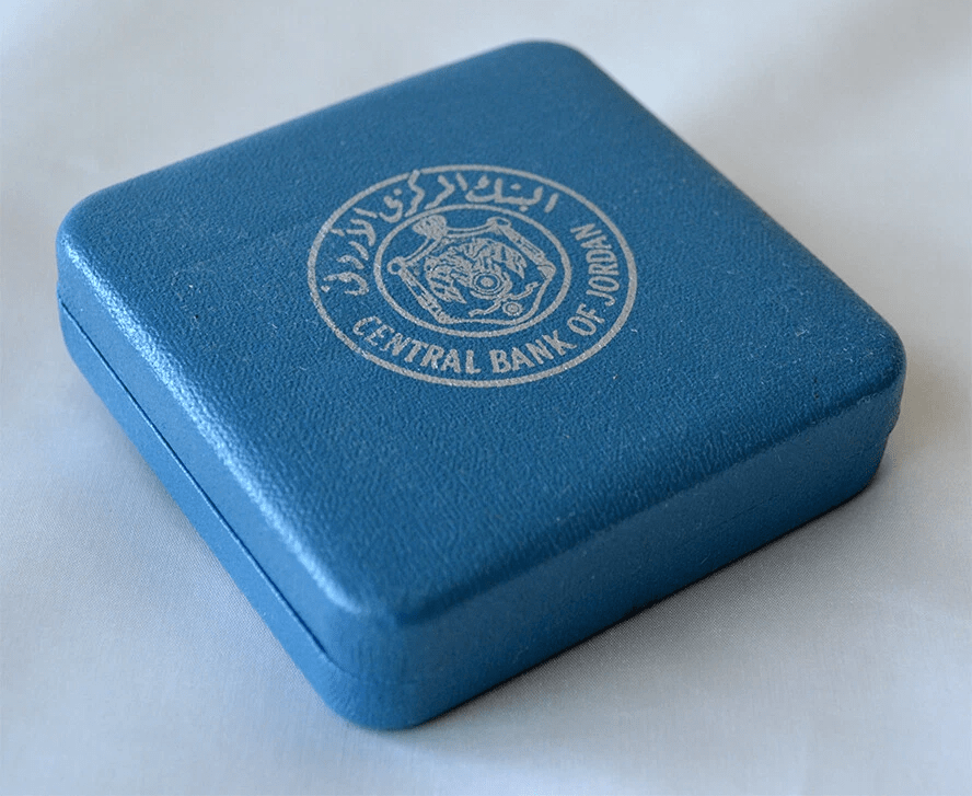 Closed blue Central Bank of Jordan presentation case for 1992 silver coin